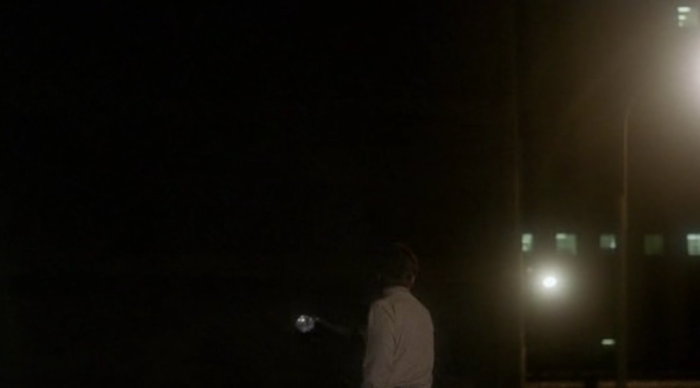 Man running away at night in Breeders