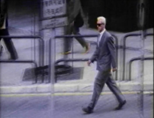guy wearing glasses and suit in hong kong