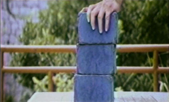hands on top of blue bricks