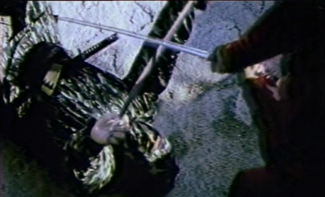 ninja deflecting sword on ground